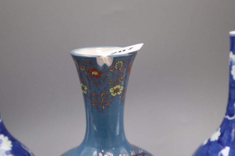 A pair of Chinese blue and white dragon bottle vases and a Fukagawa enamelled blue ground vase, tallest 25cm